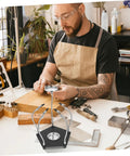 Man using Helping Hands Soldering Tool With LED Magnifying Lamp And Adjustable Arms in workshop