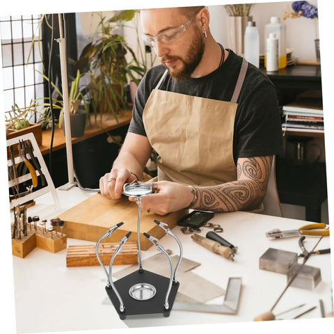 Man using Helping Hands Soldering Tool With LED Magnifying Lamp And Adjustable Arms in workshop