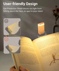 USB Rechargeable Clip On Reading Light With Amber And Warm White Modes illuminating a book with eye-friendly design