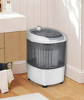 Slick Compact Mini Washer And Dryer Combo, 5.5 Pound Portable Laundry Rig in sharp grey placed in a corner of a small space.