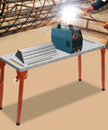 Heavy Duty Welding Table With 1000 Pound Load Rating Fold Flat Steel Workbench featuring a blue welding machine and metal pipes on a sturdy surface.
