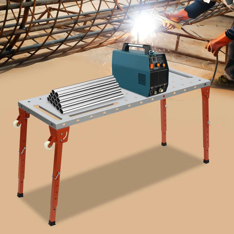 Heavy Duty Welding Table With 1000 Pound Load Rating Fold Flat Steel Workbench featuring a blue welding machine and metal pipes on a sturdy surface.