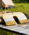 Dope U Shape Deck Stain Brush with double bristles resting on outdoor table, ideal for smooth color coating on various surfaces.