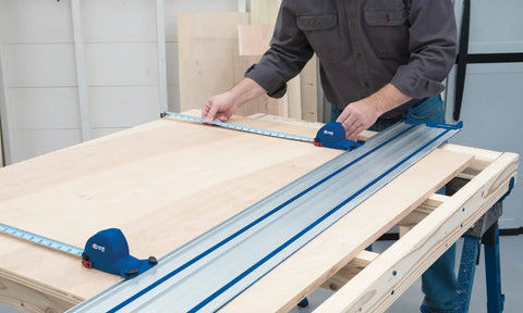 Using Adaptive Cutting System Parallel Guides For Track Saws ACS415 for precise woodworking on a large sheet in a workshop