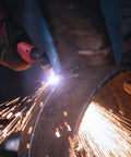 Plasma cutting with 60 Piece Plasma Cutting Consumables Kit For PT31 JG-40 LG-40 Torches, showing sparks and precision.