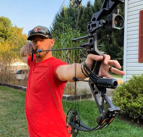 Archery demonstration with Dragon X7 Ready To Hunt Compound Bow Kit For Adults, 0-70 Lbs Draw, outdoor setting