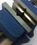 Four Inch Self Centering Milling Vise For Precision Metalworking Sweet Action Steel Frame showing double grooved vee jaws close-up.
