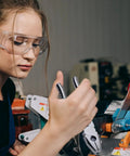 Woman using machinery with Stainless Steel 8 Inch Lineman's Pliers with Side Cutter and Wire Stripper, Combination Pliers.