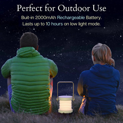 Two people sitting outdoors at night with Grab And Go Rechargeable LED Lantern With 2000mAh Battery, glowing softly.