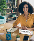 Woman at desk with 4 Pack Clear Acrylic Desk Name Plates Set With Double Sided Design, Personal Name Tag block front, office setting.