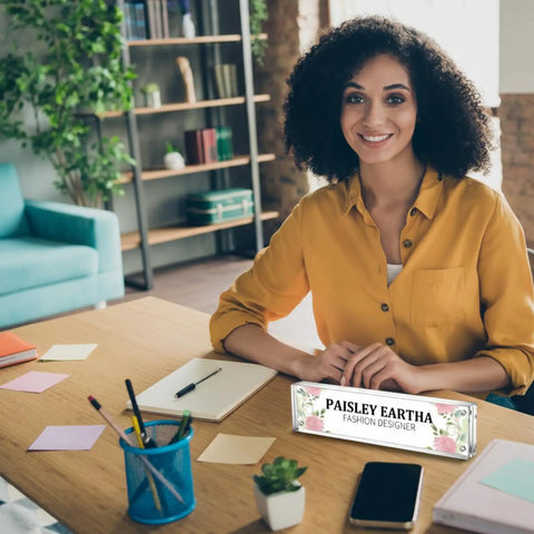 Woman at desk with 4 Pack Clear Acrylic Desk Name Plates Set With Double Sided Design, Personal Name Tag block front, office setting.