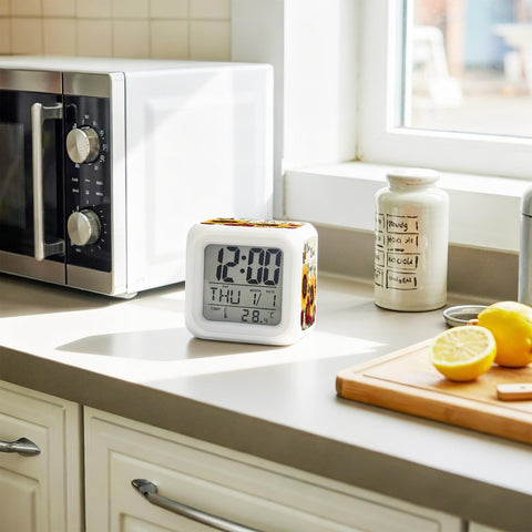 Total Game Changer Farmhouse Sunflower Butterfly Digital Cube Clock With Led Time Date Temp Readout on kitchen counter.