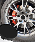 Sleek Black 55Mm Abs Wheel Center Caps 4Pack Heavy Duty Snap On Rim Covers Universal Fitment on sporty wheel with brake caliper.