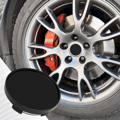 Sleek Black 55Mm Abs Wheel Center Caps 4Pack Heavy Duty Snap On Rim Covers Universal Fitment on sporty wheel with brake caliper.