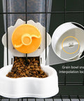 Hassle Free No Sweat Automatic Pet Water Dispenser And Food Feeder Combo with orange knob and white bowl filled with kibble.