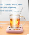 Smart Electric Mug Warmer With Three Heat Modes And Automatic Shutoff Keeps Your Daily Brew Piping Hot Without The Burn on a desk with heated glass mug.