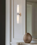 Duo 21 Inch Modern Wall Sconce With Frosted Glass Cylinder Shades Linear Two Light Silver Wall Light In Brushed Nickel Finish mounted vertically
