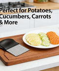 Potato cutter with black handle and stainless steel wavy blades on a wooden cutting board, angled view.