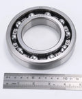 Open Deep Groove Ball Bearing 65x120x23mm Beefy Steel Build For Heavy Duty Machinery, 1 Pack, Precision Fit, Smooth Operation, And Long Lasting Performance, shown with ruler