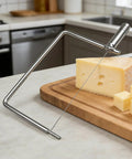 Rock Solid Stainless Steel Cheese Slicer Accessories For Hard Cheddar And Butter No Sweat Wire Cutter with cheese on wooden board.