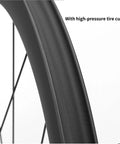 Close-up of Carbon Fiber Road Wheelset Pro Grade 700C rim with center lock disc brake and 24-hole design, showing tire cushion.