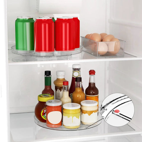 Two Pack Clear 9 Inch Lazy Susan Turntable Rotating Organizer Tray For Cabinet And Countertop Use Non Slip Round Spice Rack Refrigerator Kitchen Pantry Bathroom Storage with drinks and sauces in a fridge.