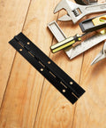 Heavy Duty Iron Piano Hinges Set for Doors and Cabinets, black 6 inch continuous hinge on wooden surface with tools