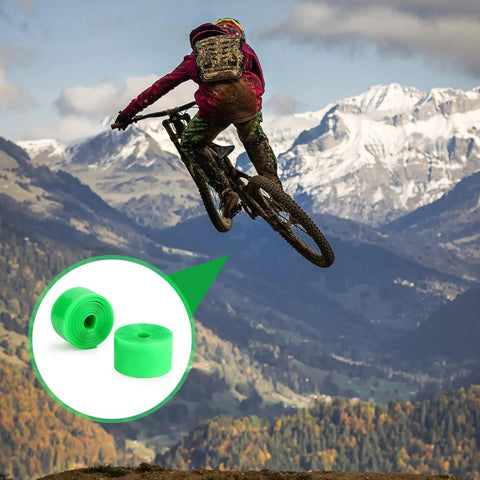 Mountain biker mid-air with inset showing Two Pack Bike Tire Liners For Flat Protection, Bicycle Rim Tape And Rim Strip Protectors.