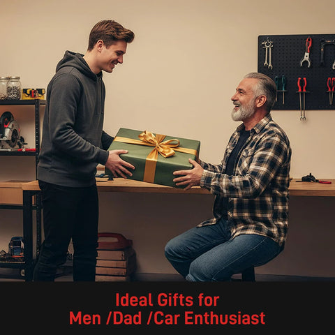 A standing young man giving a gift-wrapped box to a seated older man in a workshop, labeled 'Ideal Gifts for Men/Dad/Car Enthusiast.'