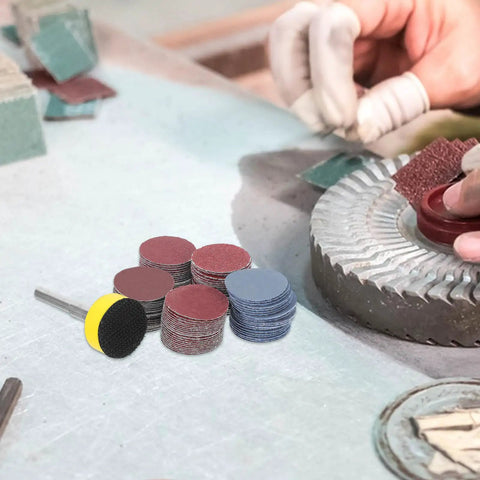 Get Your Hands On This Awesome Set Of 100pcs Sanding Discs With Grits From 100 To 3000 For Smooth Drilling And Shiny Finishes That Last with assorted discs arranged.