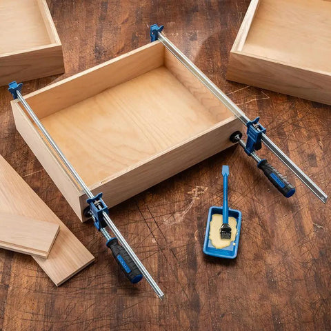 18 Inch Sure Foot F Style Clamp With No Tip Base used in woodworking project on wooden workbench.