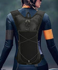 Hydration Pack Backpack With Water Bottle Holder, Reflective Strips, Lightweight Nylon Reservoir on person outdoors