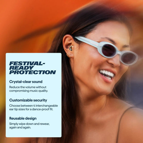 Woman wearing Experience 2 Ear Plugs For Concerts And Festivals With High Fidelity Sound And 17dB Noise Reduction, smiling at event