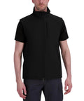 Men's Heavy Duty Softshell Vest With Smooth Four Way Stretch And Plush Fleece Lining Designed To Keep Ya Warm Dry And Ready For Whatever The Day Throws At You This Go To Layered Outerwear Is Built To Last in black, front view, model wearing short sleeve shirt.