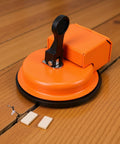 Heavy Duty Floor Gap Fixer And Puller Tool With 180 Lb Suction, Ergonomic Handle, on hardwood floor for repairs
