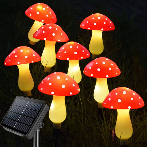 8 Pack Red Mushroom Solar Lights For Outdoor Garden Decor With 8 Lighting Modes, visible glowing red mushrooms at night
