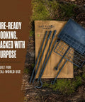 Swivel Grill Set For Campfire Cooking In The Great Outdoors with steel grate and components on forest floor