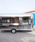 Fully Equipped Compact Concession Food Trailer Mobile Kitchen For Street Vending Hot Dog Coffee Cart with open windows and steel body.