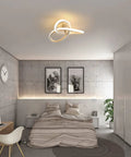 Elegant flower-like spiral LED ceiling light fixture illuminating a modern bedroom, semi flush mount 22W warm white 3000K.