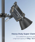 Beefy Heavy Duty Super Clamp Kit 2-Pack for Cameras Microphones Monitors and Lighting Gear securing a light to round pipe.