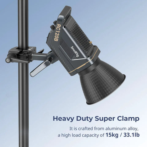 Beefy Heavy Duty Super Clamp Kit 2-Pack for Cameras Microphones Monitors and Lighting Gear securing a light to round pipe.