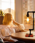 Stepless Dimmable Industrial Nightstand Lamp With Dual USB Ports, Edison Rustic Metal Pipe Look on table in cozy living room