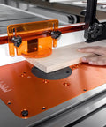 Dead Flat Cast Iron Router Table Extension Wing, 27 By 16 Inches, used for precision routing with safety guard in place.