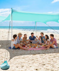 Group under Roomy Fourteen By Eleven Foot Beach Sun Shelter With UPF50 Plus Protection, Center Height Seven Point Two Feet, Fits Eight To Twelve People