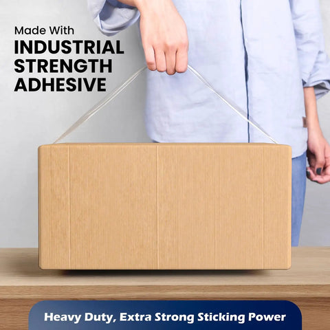 Person holding box sealed with 2 Inch Clear Packing Tape 2.4 Mil Thick 110 Yards Per Roll 36 Rolls Total Heavy Duty Shipping And Moving Tape