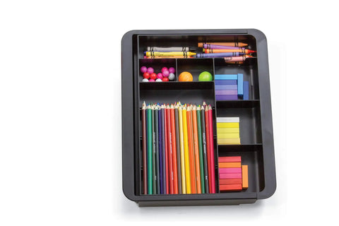 Slick Expandable Drawer Organizer Tray With Adjustable Width And Removable Dividers For Hustle Ready Desk Organization In Smooth Recycled Black Plastic Finish filled with colored pencils, crayons, and supplies.