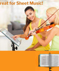 Two women practicing music with an aqua Meeting Ready 24-Pocket Presentation Binder For 8.5x11 Documents on a music stand.