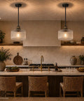 HXXLFONEDP 2 Pack Glass Pendant Lights for Kitchen Island, Matte Black in a kitchen over an island with ribbed glass shades.
