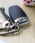 Set of keys with Titanium D Ring With Screw Shackle For Key Chains And Pet Collars D Shape Heavy Duty Ring, matte finish.