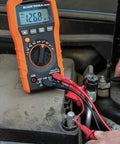 Auto-Ranging Digital Multimeter Pro Grade For DIY And Tech Pros, Reads 600V AC/DC, 10A Current in use on a car battery